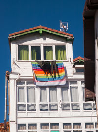 Low angle view of building against blue sky