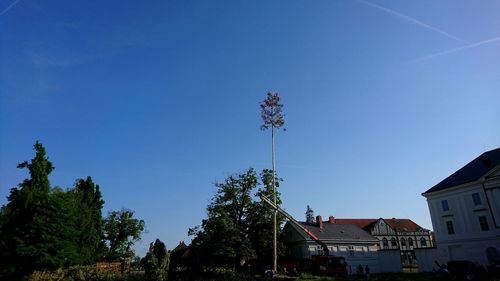 Low angle view of buildings against blue sky