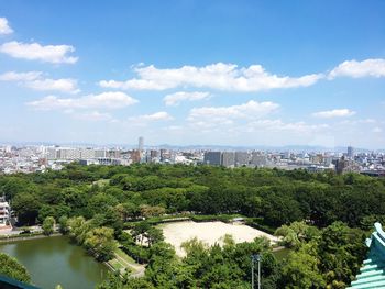 High angle view of city against cloudy sky