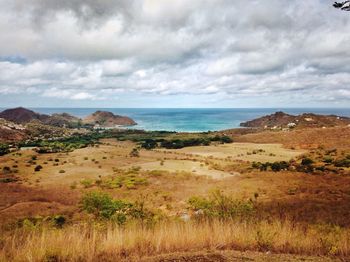 Scenic view of sea against cloudy sky