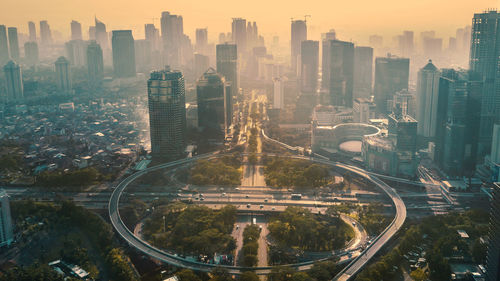 High angle view of modern buildings in city against sky