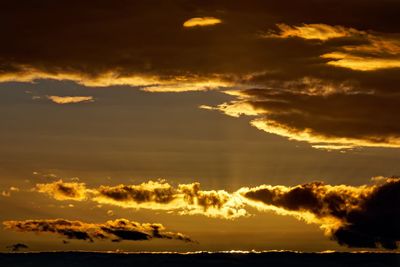 Low angle view of dramatic sky during sunset