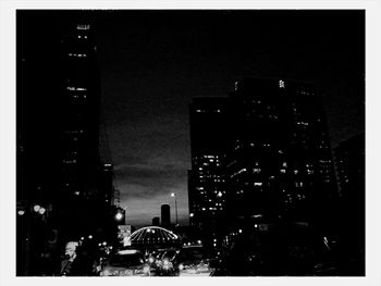 Buildings in city at night