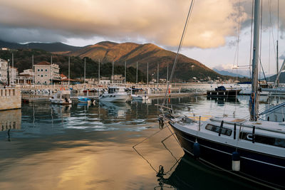 Boats moored at harbor