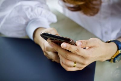 Close-up of woman using mobile phone