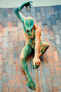 Low section of woman standing on footpath