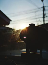 Close-up of silhouette man against sky during sunset