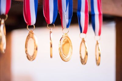 Close-up of medals hanging in mid-air