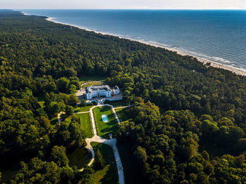 High angle view of trees by sea