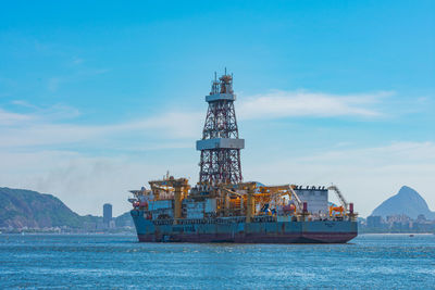 Ship in sea against sky