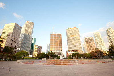 Modern buildings in city against sky