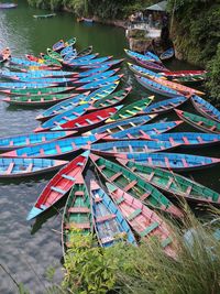 High angle view of multi colored boats moored on river