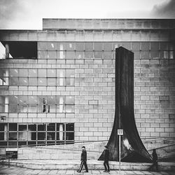 Woman standing in front of building