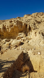 Rock formations in desert against sky