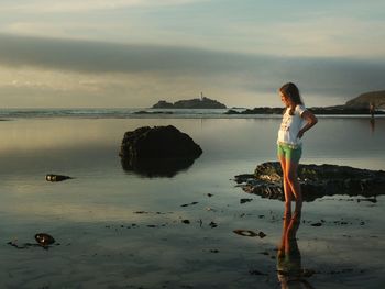 Rear view of man standing on beach