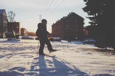 Full length of man on snow covered landscape