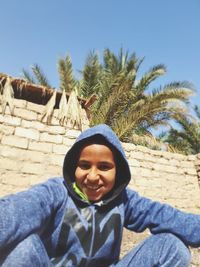 Portrait of smiling young woman outdoors