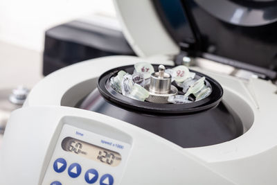 Table centrifuge filled with tubes. spin column-based nucleic acid purification technique.