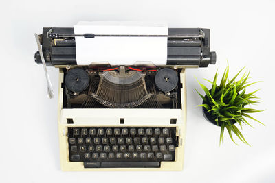 High angle view of telephone booth on table against white background