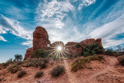 Rock formations on landscape against sky