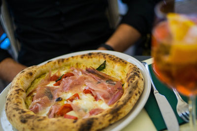 Close-up of pizza served on table