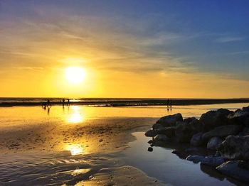 Scenic view of sea at sunset