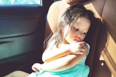 Girl sitting in car