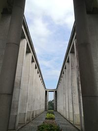 Low angle view of aisle against sky