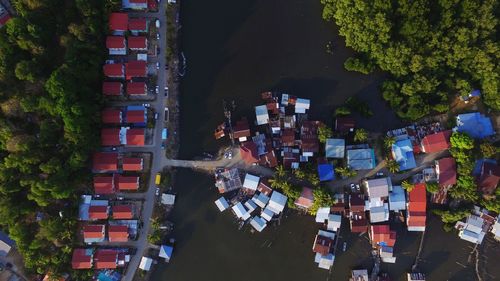 High angle view of people standing amidst buildings in city