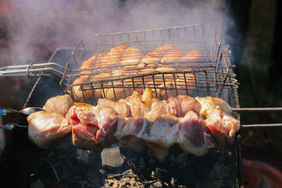 Close-up of meat on barbecue grill