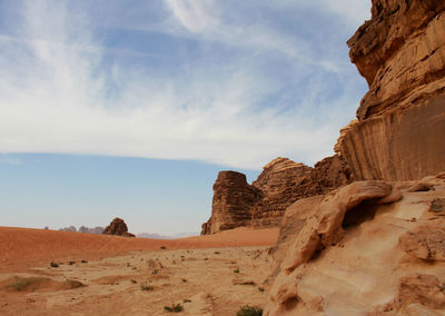 Rock formations in desert against sky