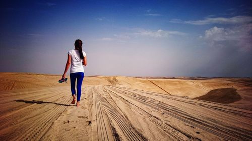 Woman standing on beach