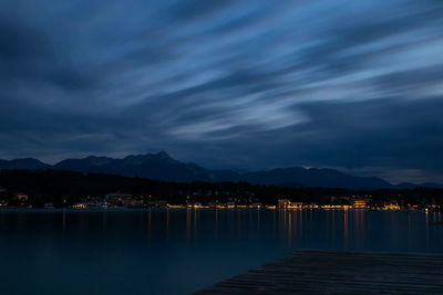 Scenic view of lake against sky at night
