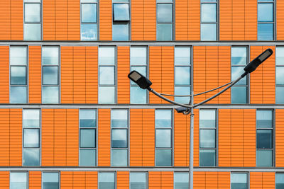 Orange facade  behind street light