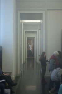 People walking in corridor of building