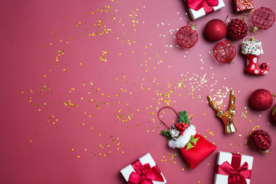 Directly above shot of christmas decorations on yellow background