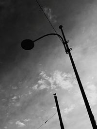 Low angle view of silhouette tree against sky