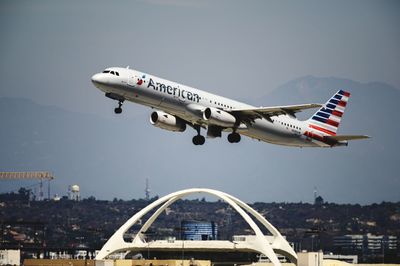 Airplane flying against clear sky