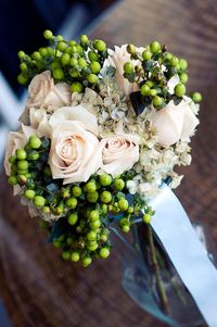 High angle view of roses in vase on table