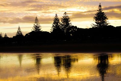 Scenic view of lake against orange sky