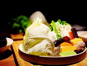 Close-up of fruits served in plate on table