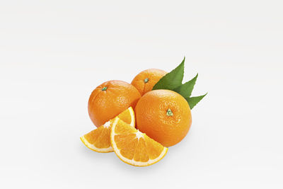 Close-up of orange fruit against white background