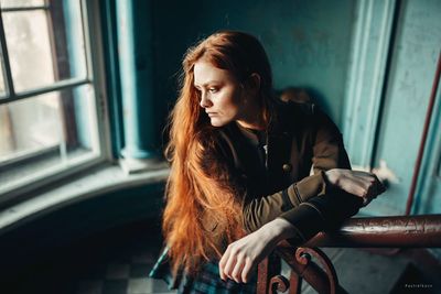 Young woman sitting in bus