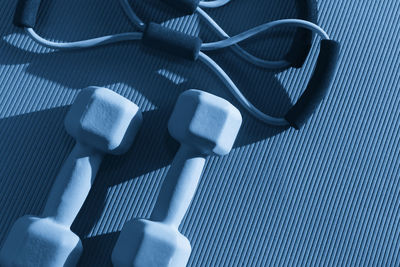 High angle view of dumbbells on table