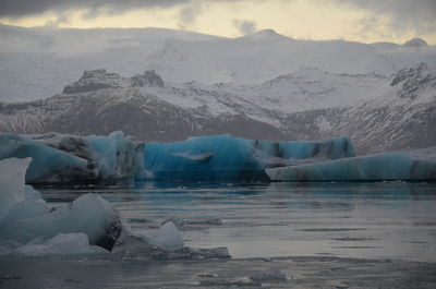 Scenic view of frozen lake against sky