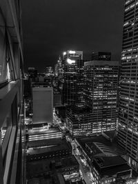 High angle view of illuminated buildings in city at night