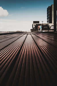 Surface level of railroad tracks against buildings in city