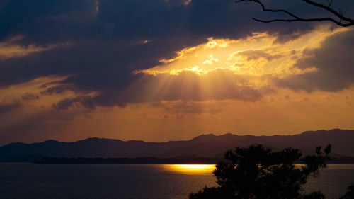 Scenic view of silhouette mountains against sky during sunset