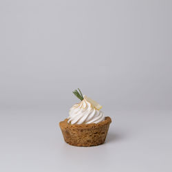 Close-up of cake on white background