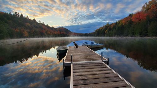 Pier on lake against sky